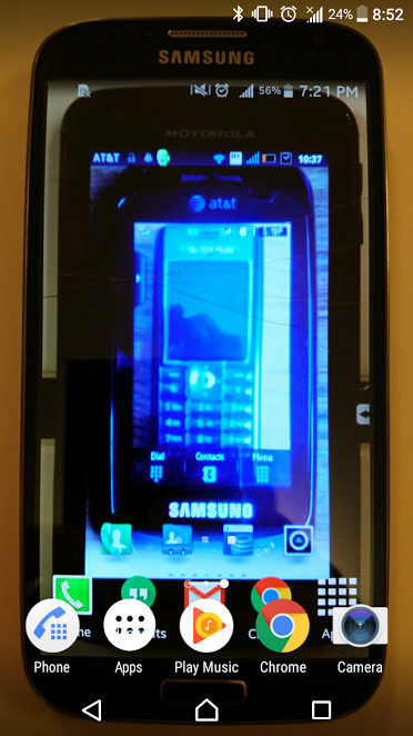 "Phoneception" - Whenever I upgrade my phone I snap a pic of the old phone with this photo as the background. I find it pretty amusing but my wife hates it.