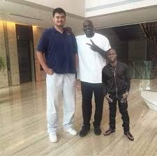 Shaq and Yao Ming make Kevin Hart look photoshopped into a picture.