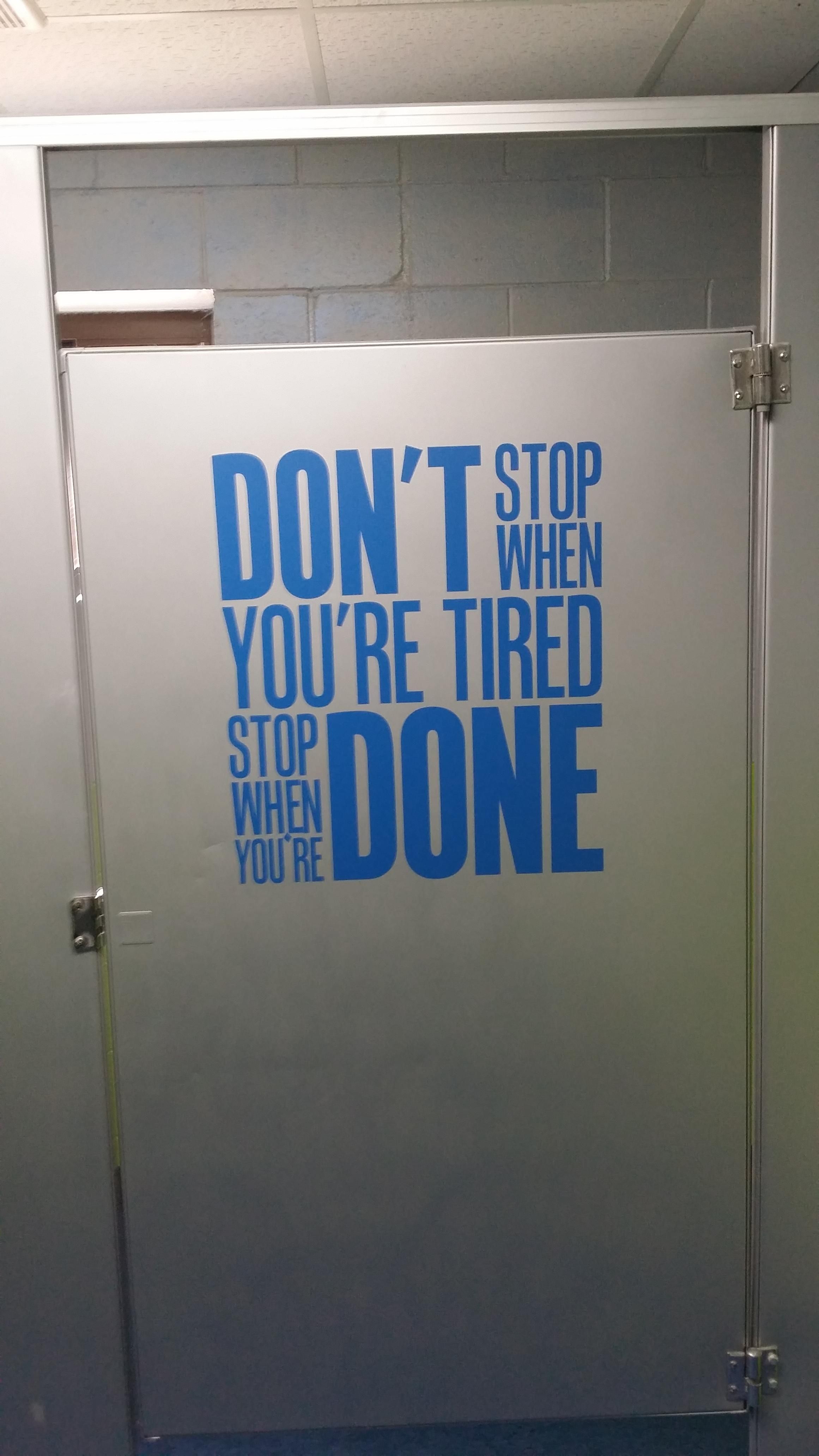 Motivational bathroom stall door