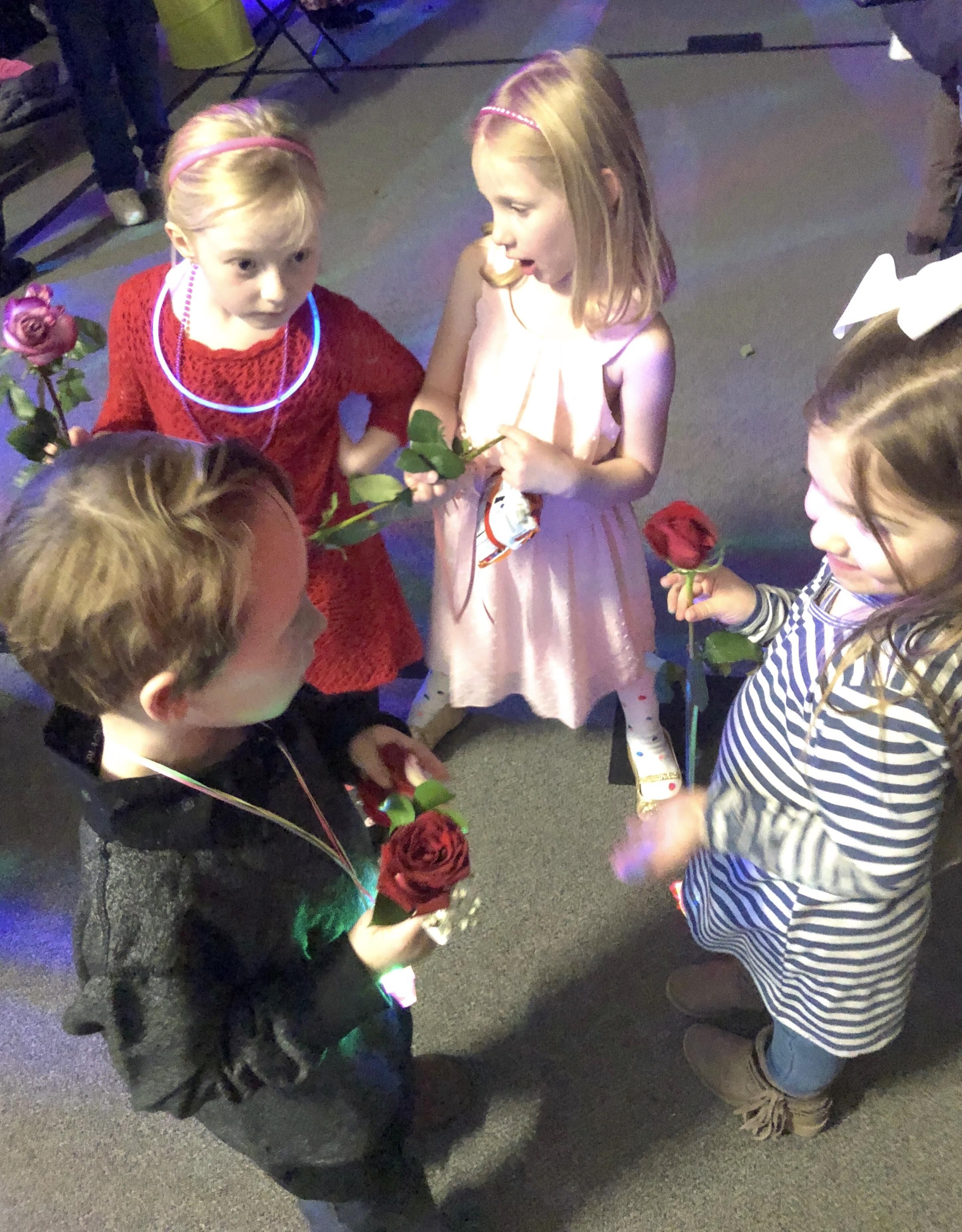 My 6 year old son had his first school dance tonight. Got caught giving roses to different girls.