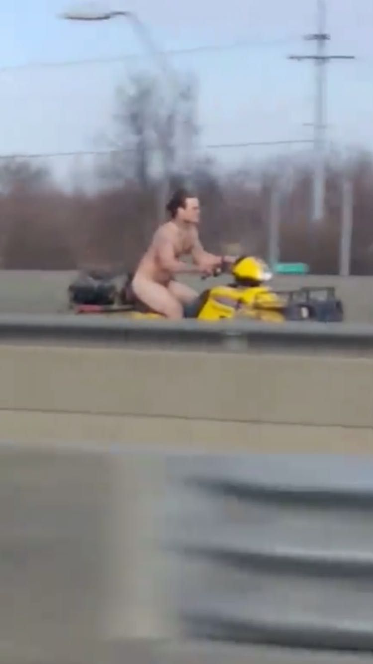 Naked man riding an ATV running from the police today in Kansas City