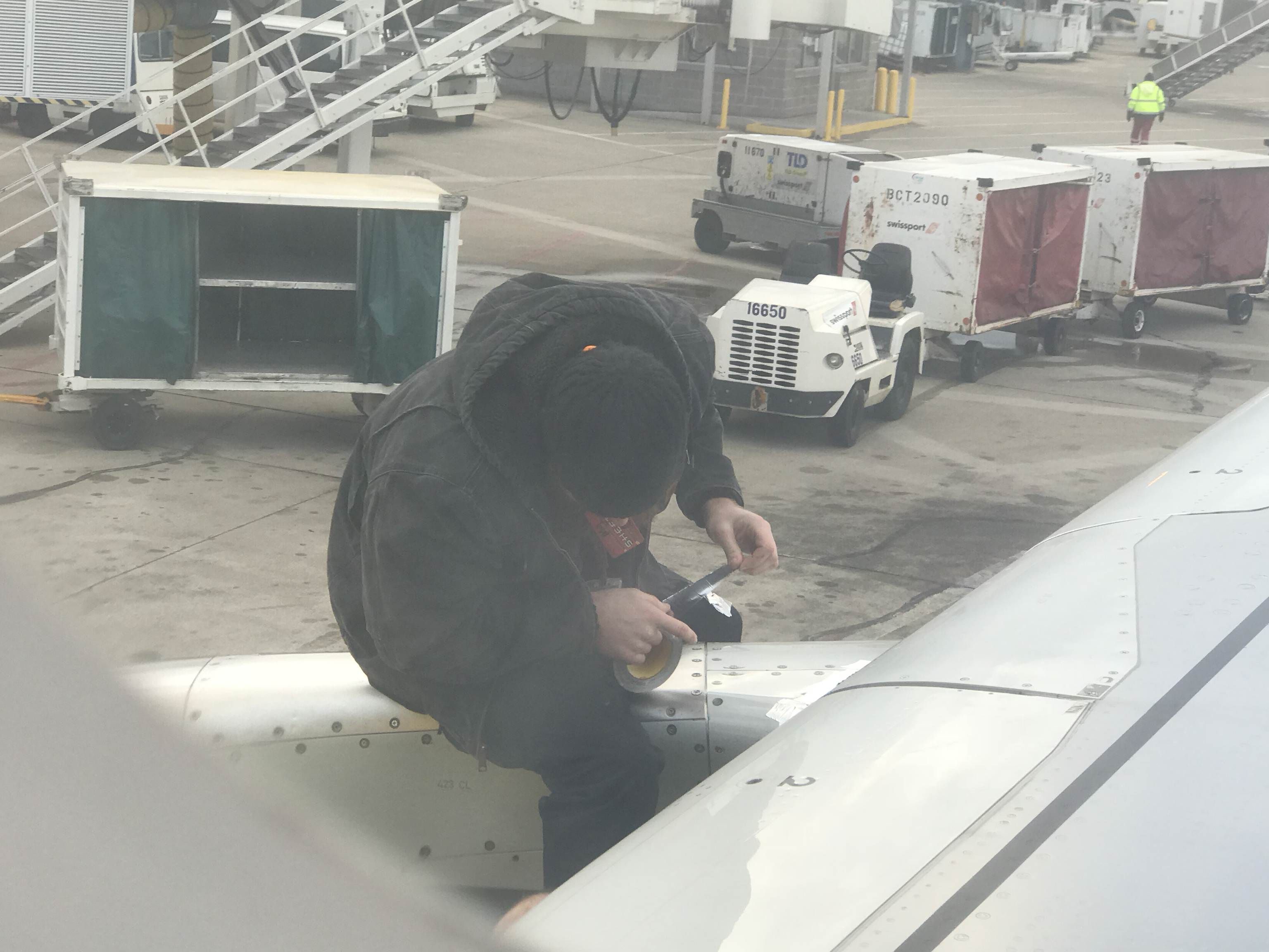 So our Spirit flight got delayed due some malfunction. Then I saw some guy duct taping our engine to a wing. WTF?