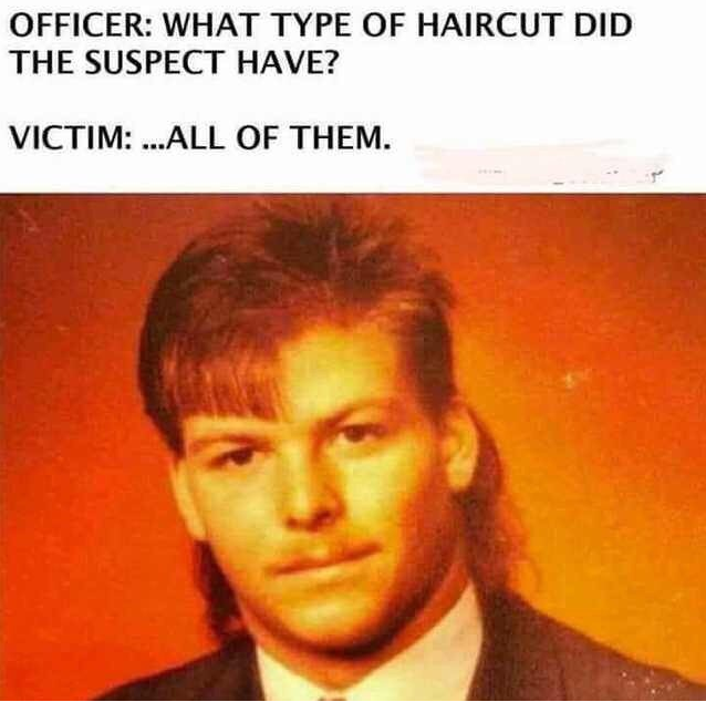 What type of haircut did the suspect have?
