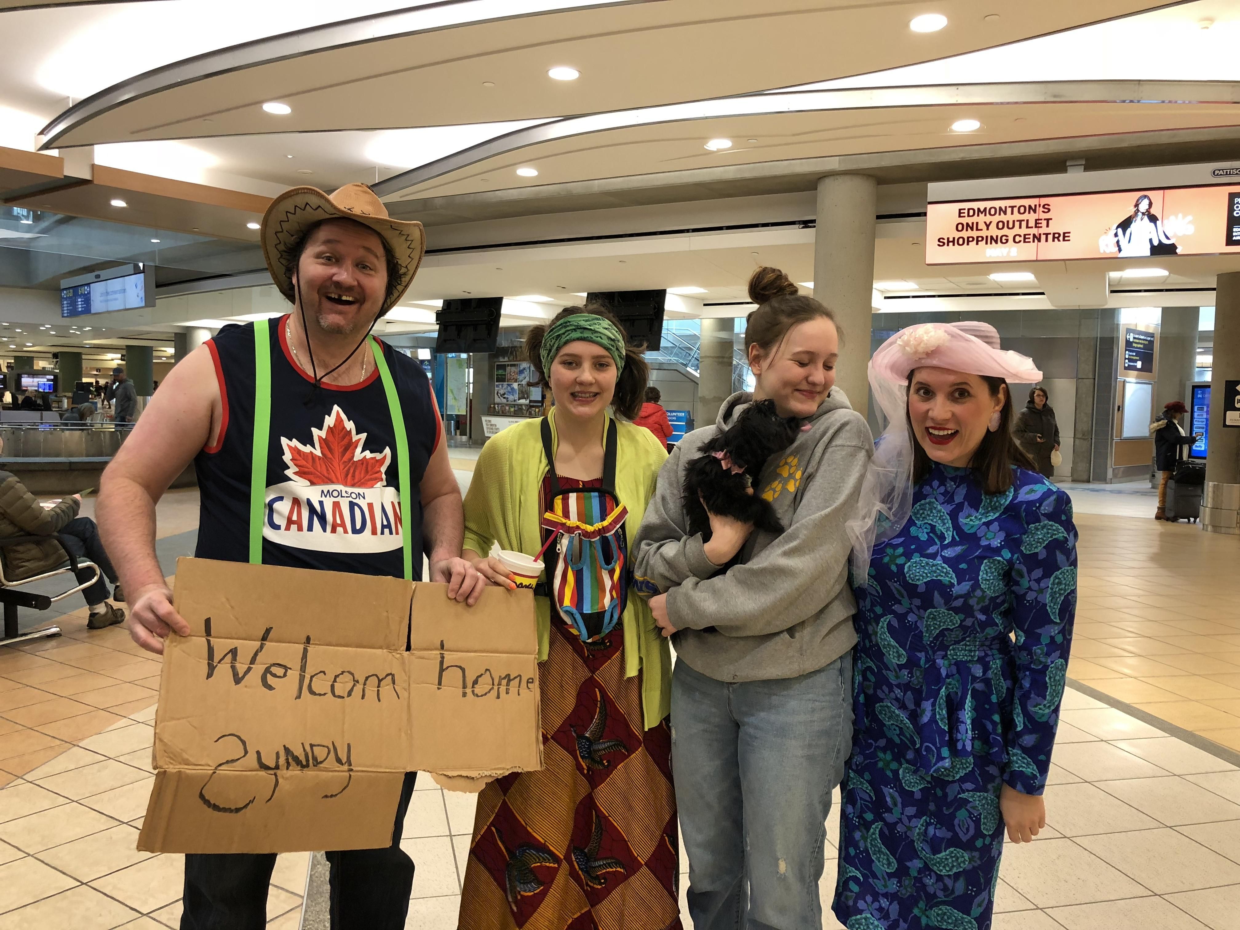 We decided to embarrass our daughter at the airport after 3 months away.