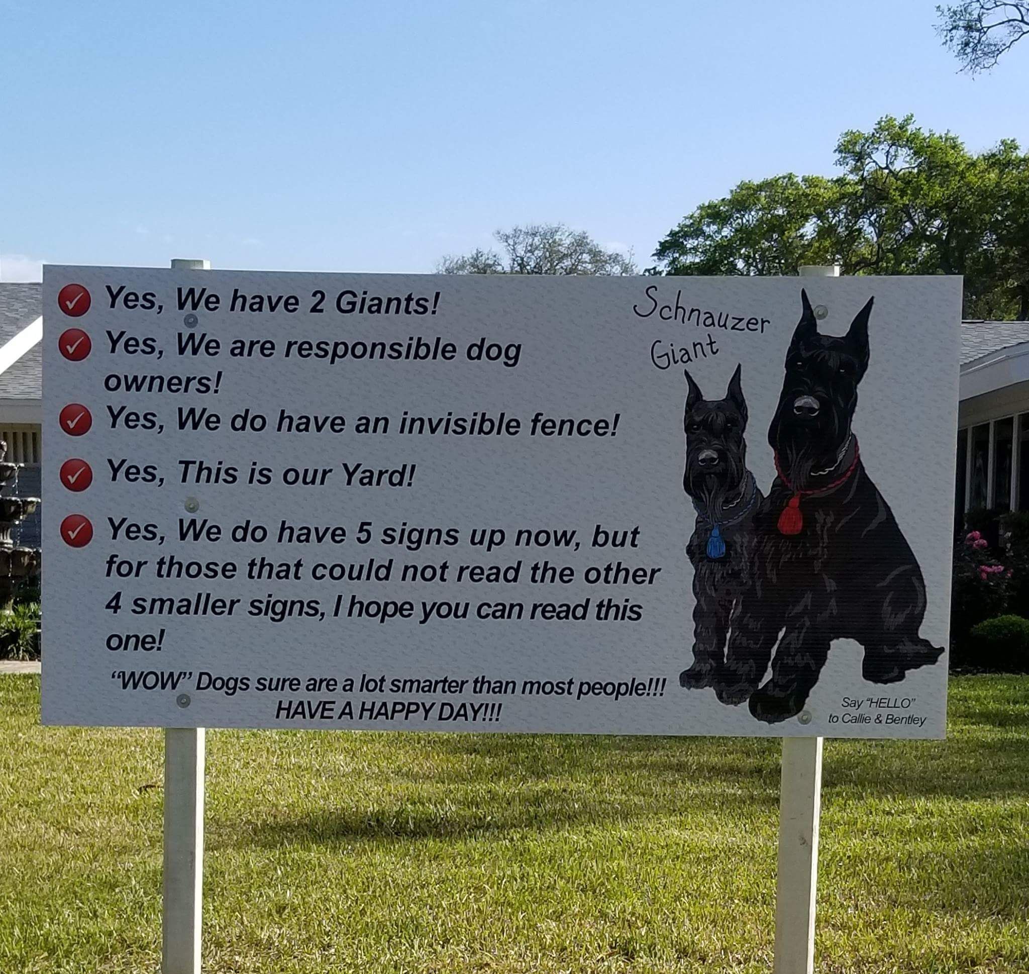 Large sign facing main road homeowner installed after recieving complaints about their dogs.