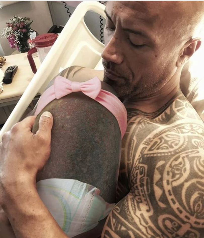 The Rock with his new baby