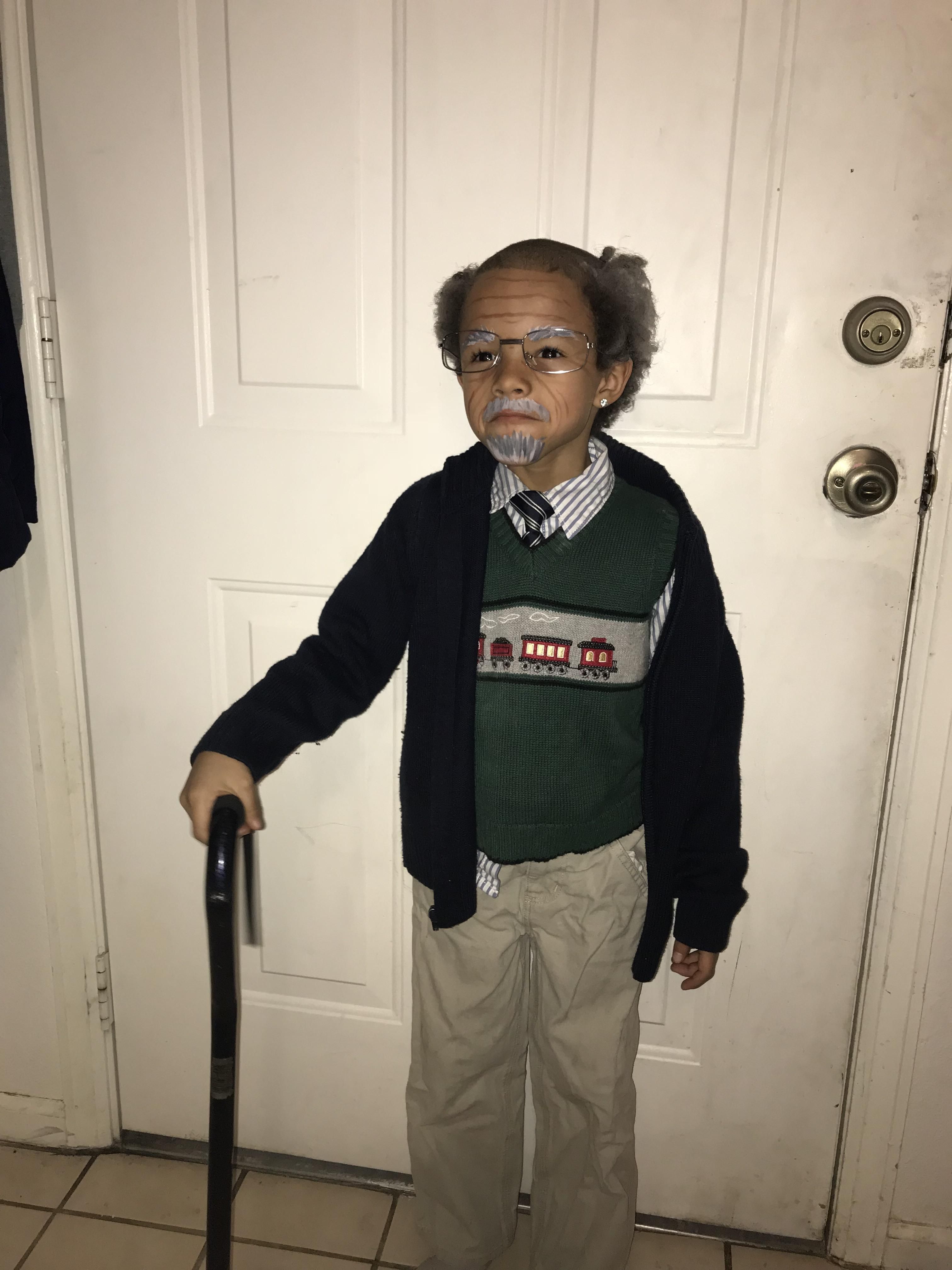 The kids were told to dress like they were 100 years old for their 100th day of school so my son got a haircut.