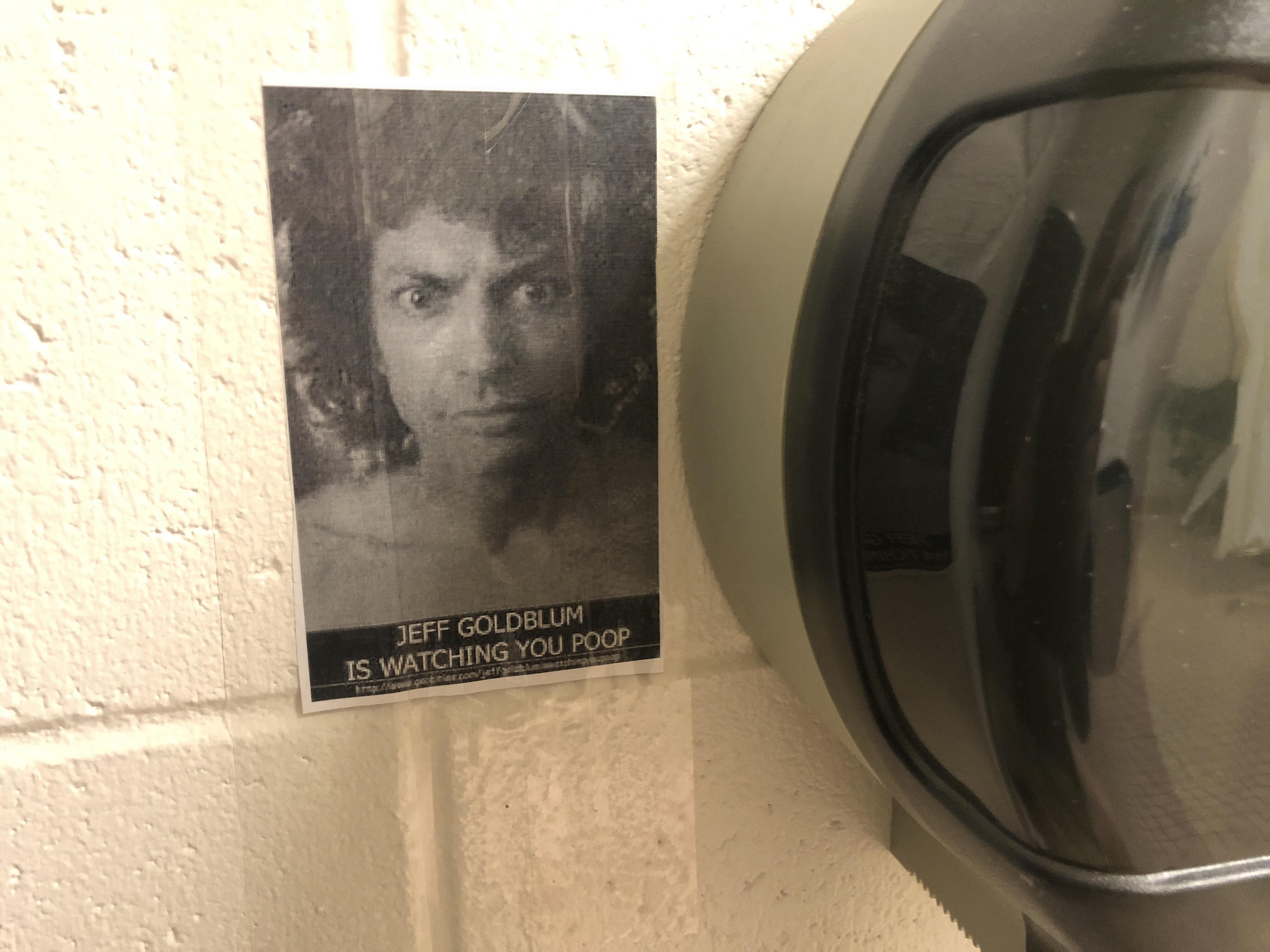This picture hidden behind the toilet paper at a maintenance shop.