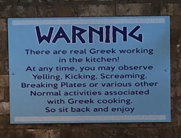 This sign is hanging in the dining area of our local Greek restaurant.