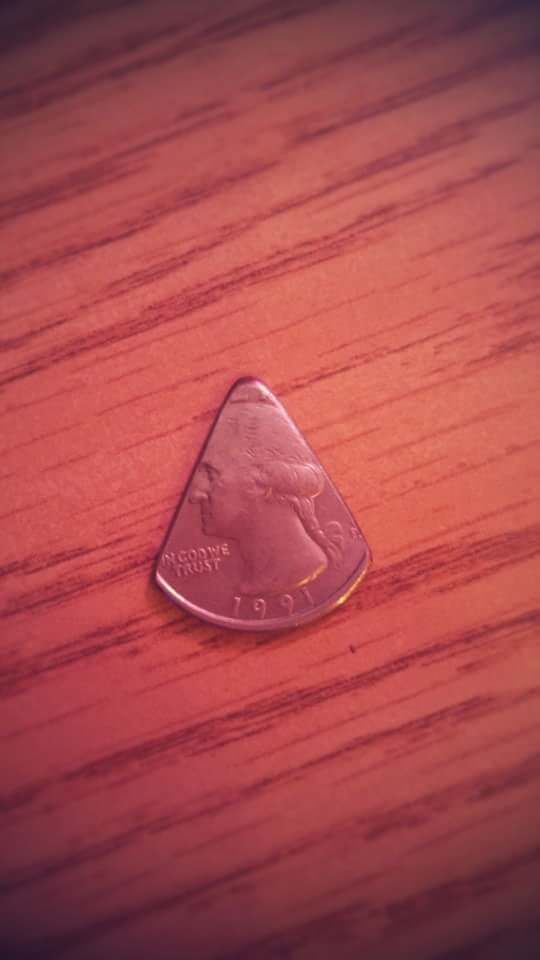 This is the guitar pick I use to play quarter notes