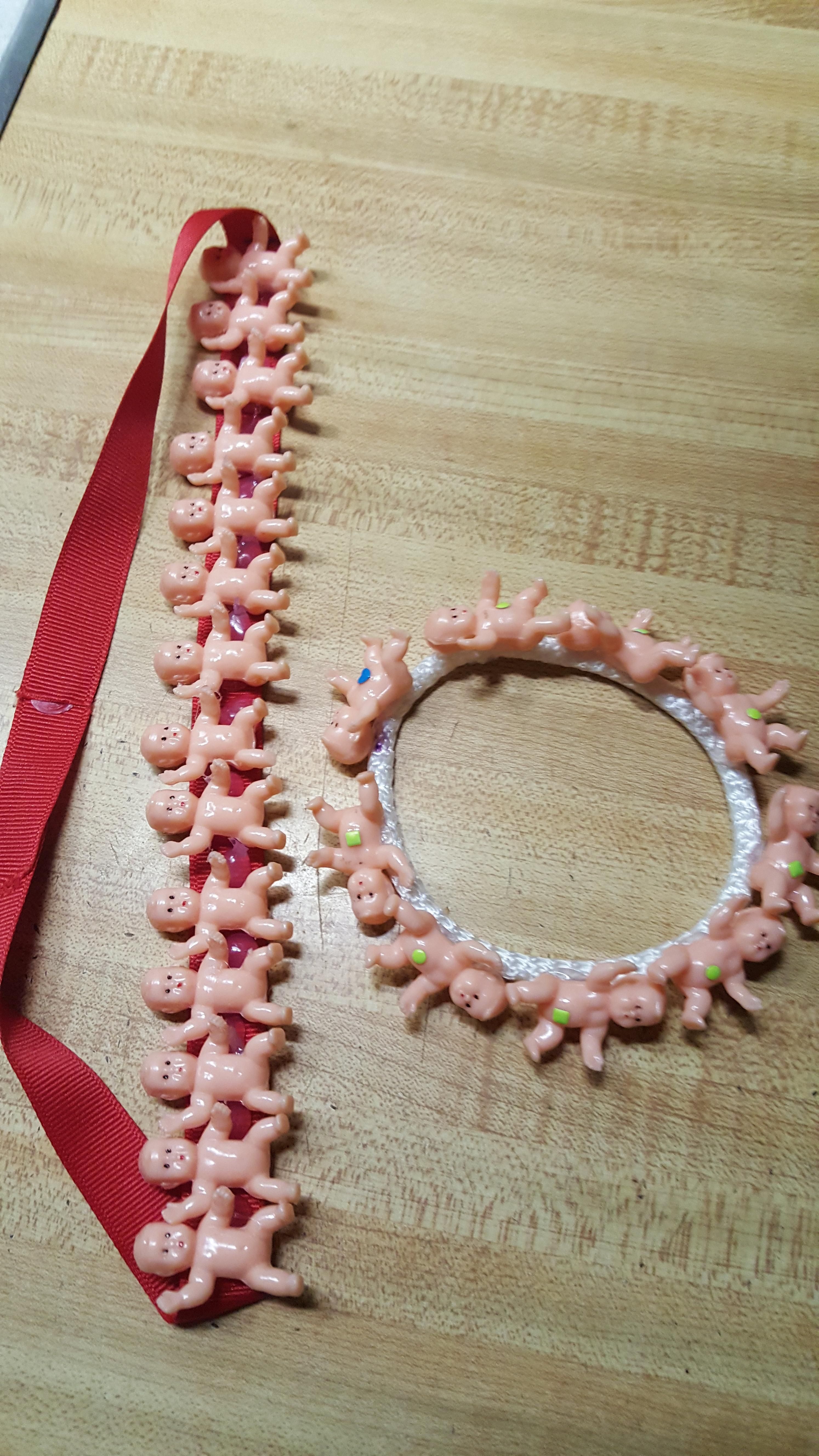 My 12 year old daughter now makes creepy baby jewelry.