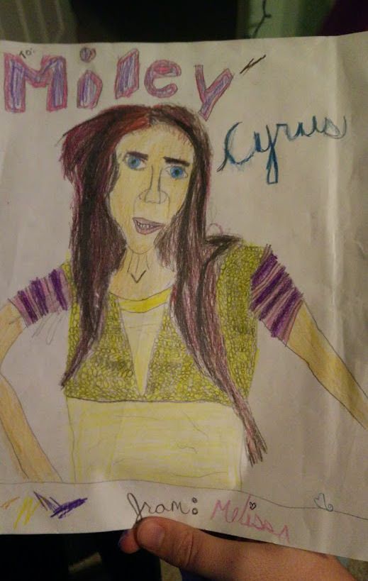 My sister's attempt at drawing Miley Cyrus somehow ended up as Nicholas Cage