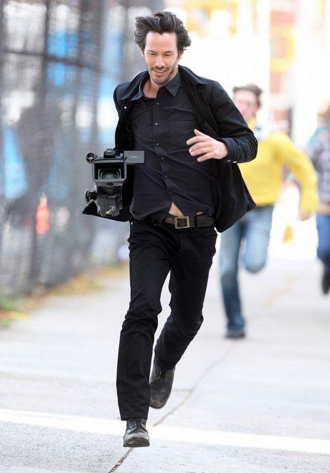 Keanu Reeves after stealing a camera from the paparazzi