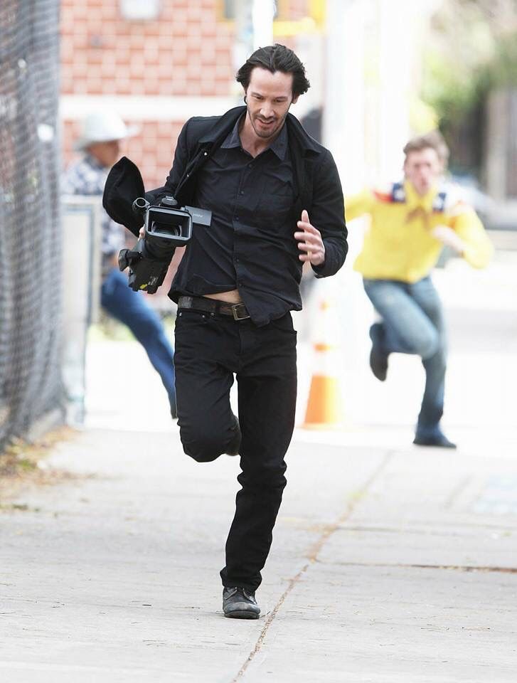 Just Keanu Reeves stealing a camera from the paparazzi..