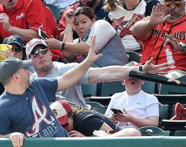 the man in red is using 'The Force' to stop the bat.