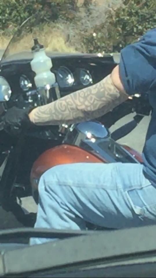Seen on the way to work. Guy on his Harley wearing fake tattoo sleeves.
