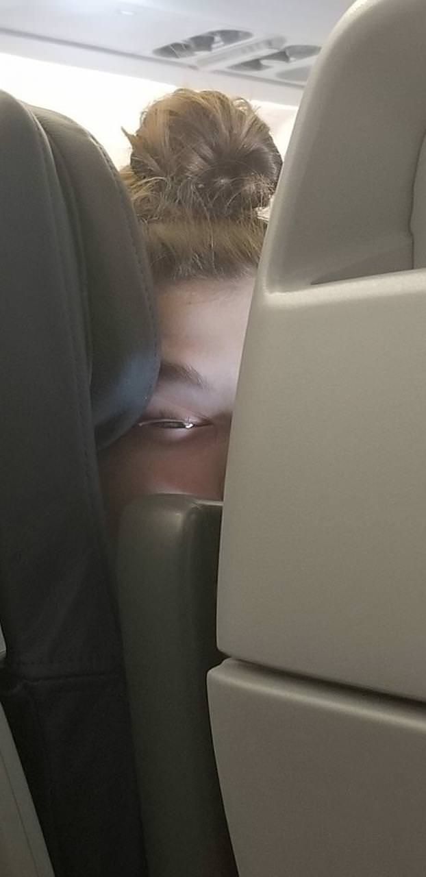 This is how the girl in front of me slept on my flight