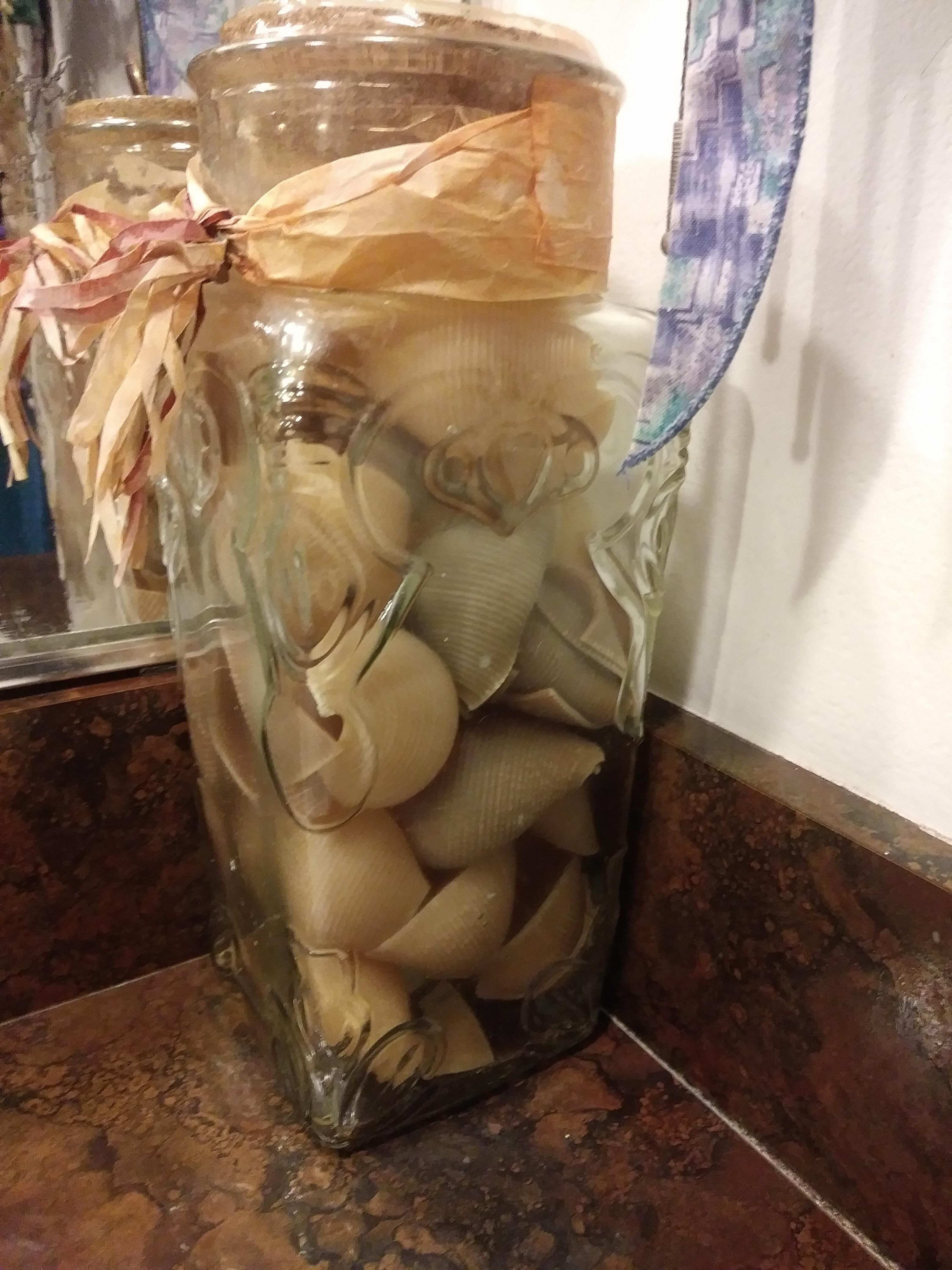 Was cleaning my mom's bathroom and realized that this jar that's been sitting there for 15 years is not filled with sea shells. It's filled with pasta shells...