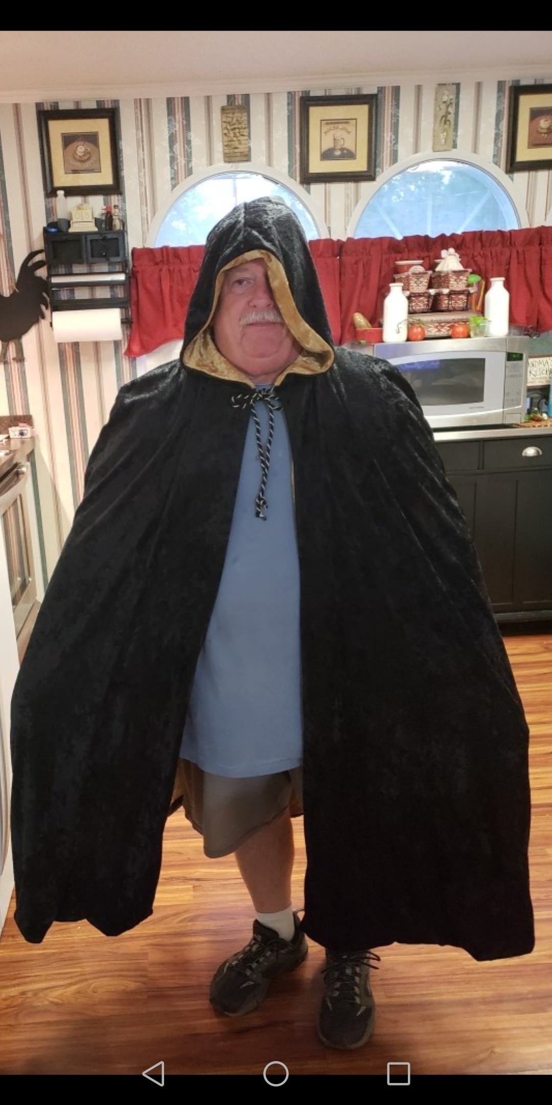 My mom made a warlock cloak for my son for Halloween. She made my dad wear it so she could send me a picture of it.