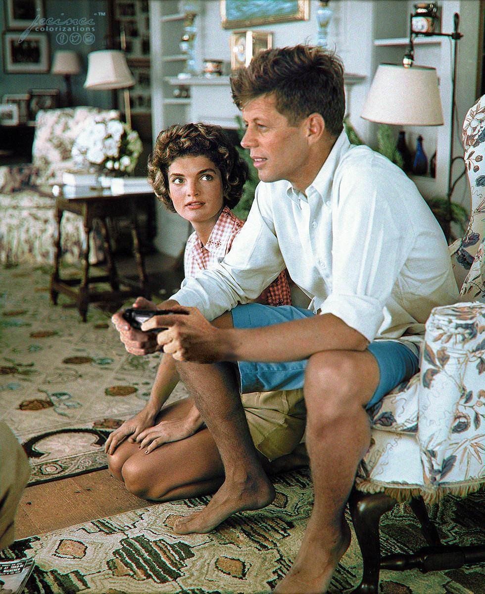 Historical photo. Jacqueline Bouvier is beging John Kennedy to buy a second wireless gamepad for the PS4.