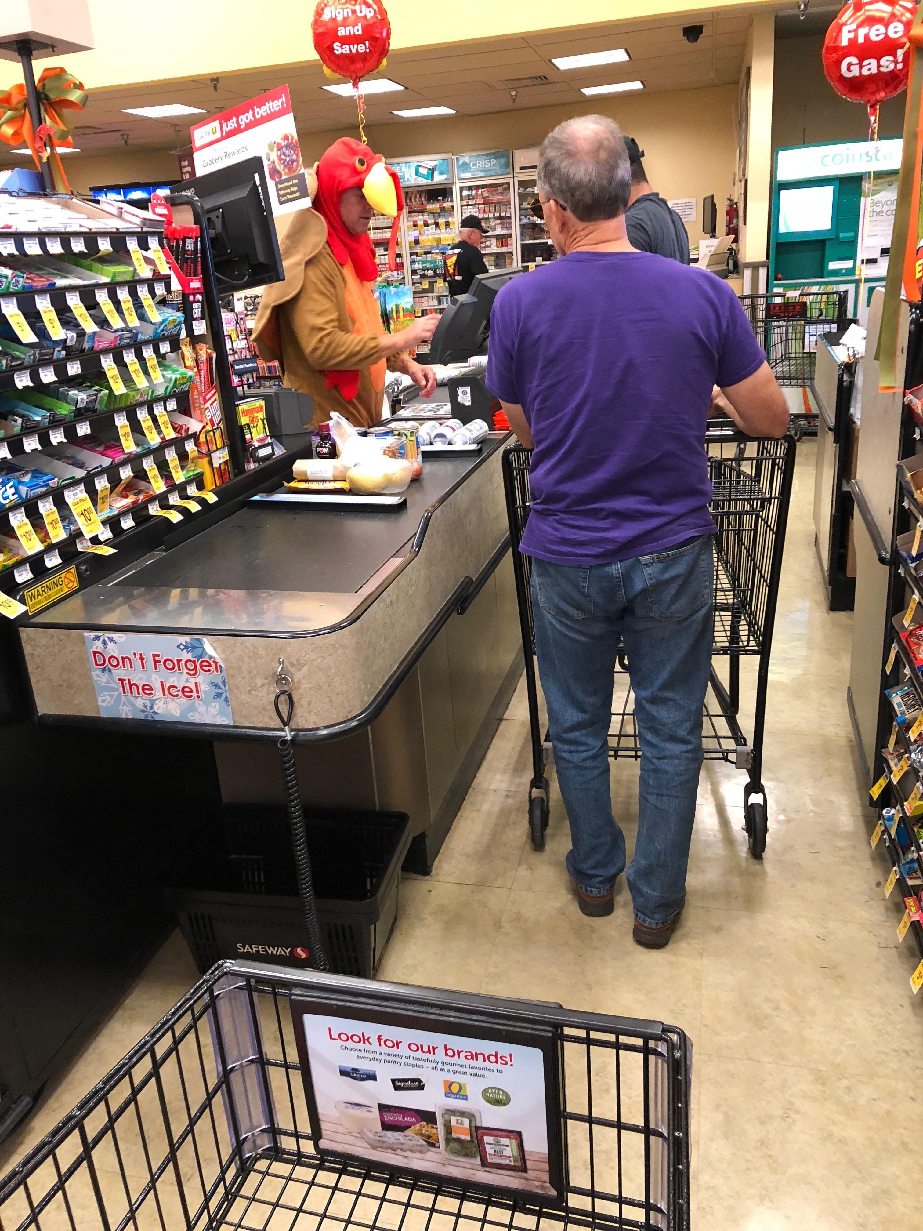 This cashier dressed as a turkey has been gobbling over the intercom every few minutes