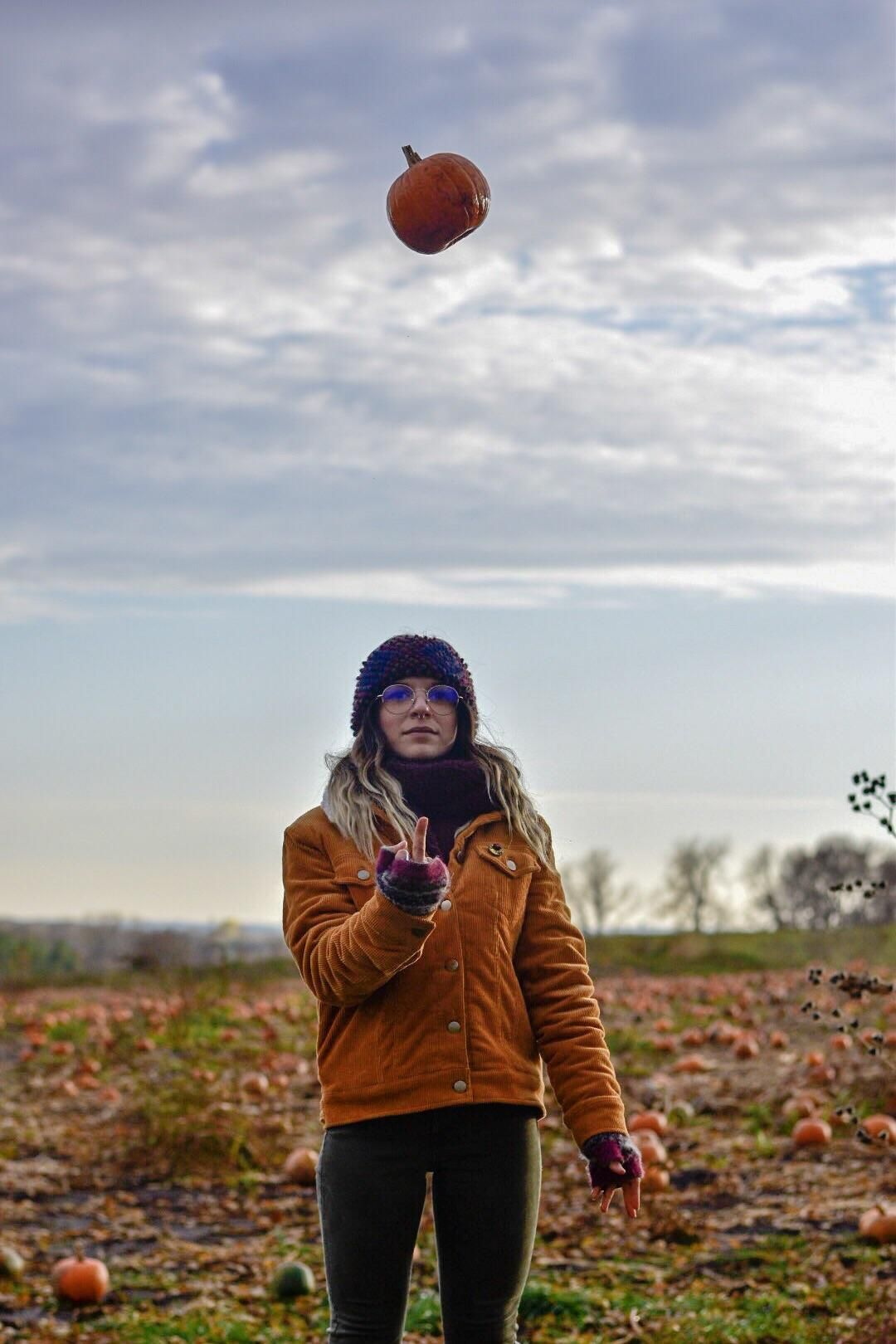 Wife asked me to take a picture of her throwing a pumpkin