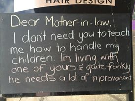 Sign in window of hairdresser, in a small country town, Australia.