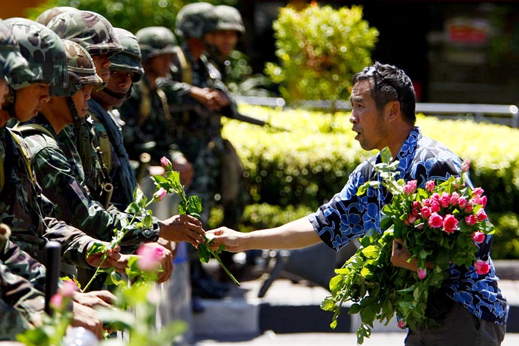 Good guy flower man during riots in Bangkok