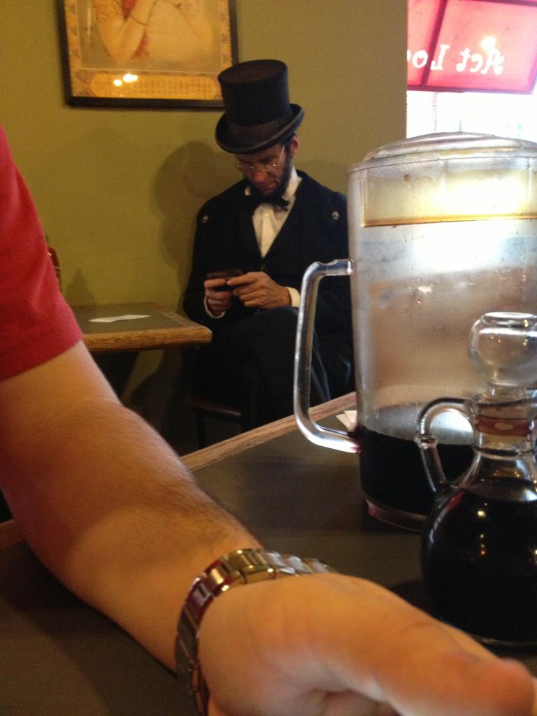 Just Abe Lincoln texting in a coffee shop