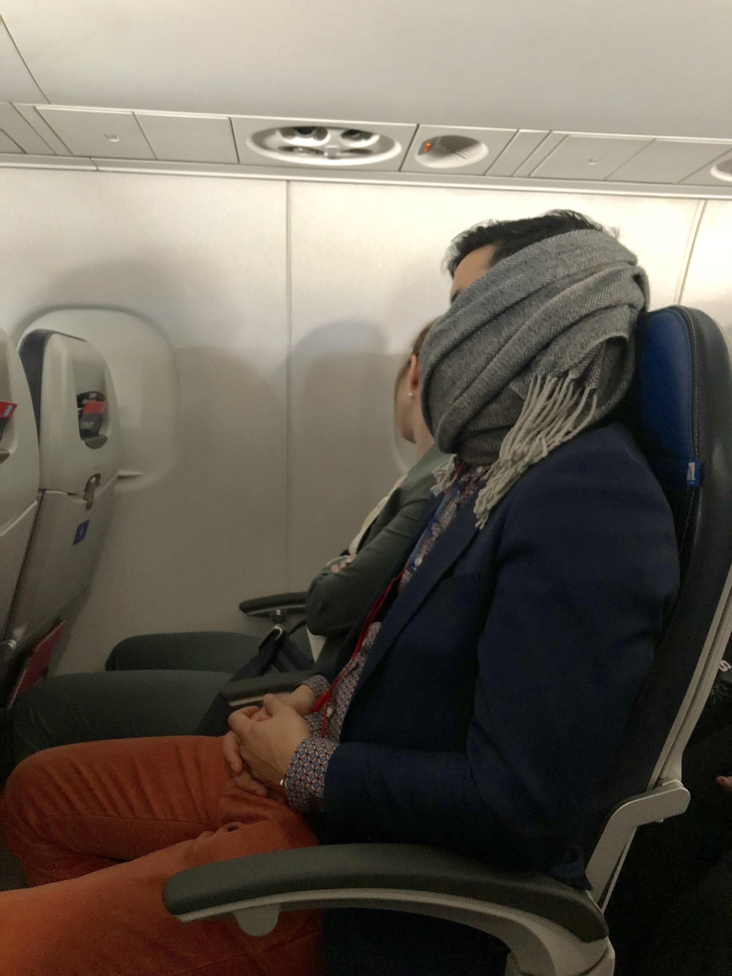 Shoutout to this hero. He woke himself up snoring, covered his mouth with his scarf, and went back to sleep. All I could hear was a slight rumble after that.