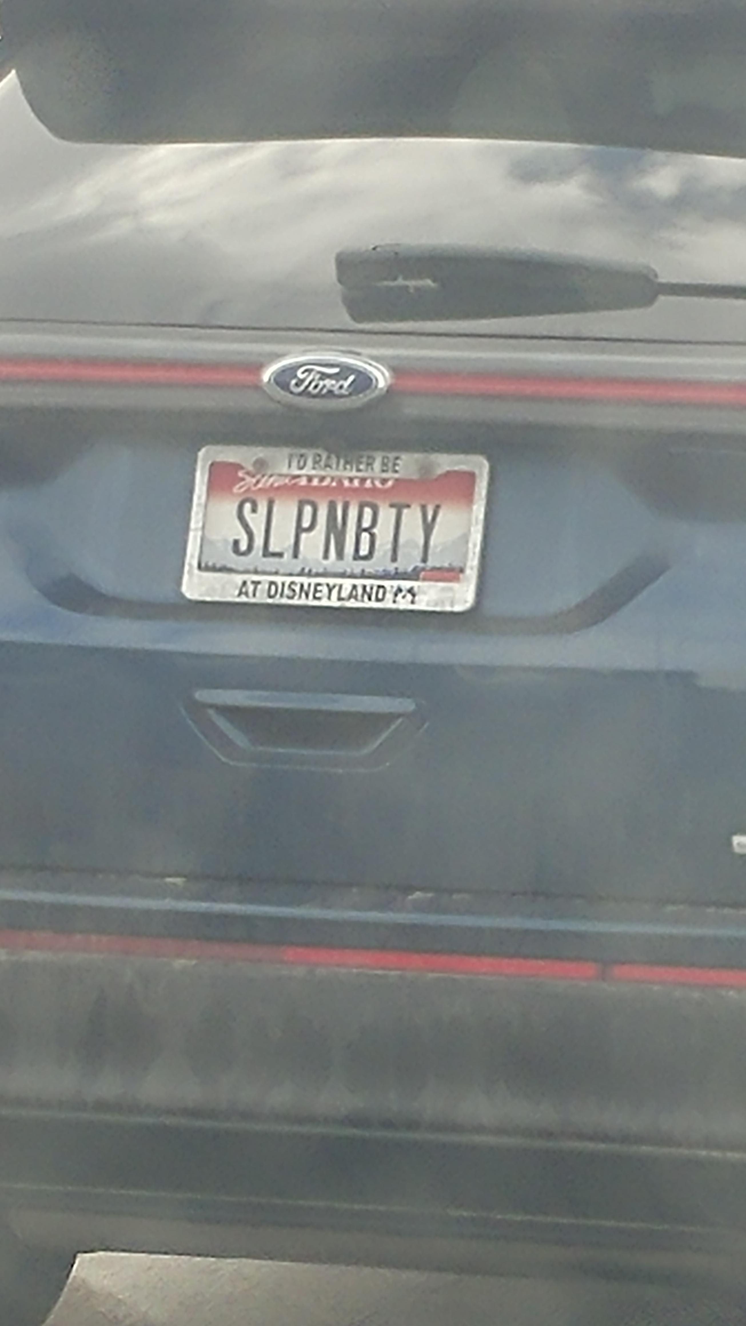 I first read this as "slappin booty" then I noticed the license plate frame.