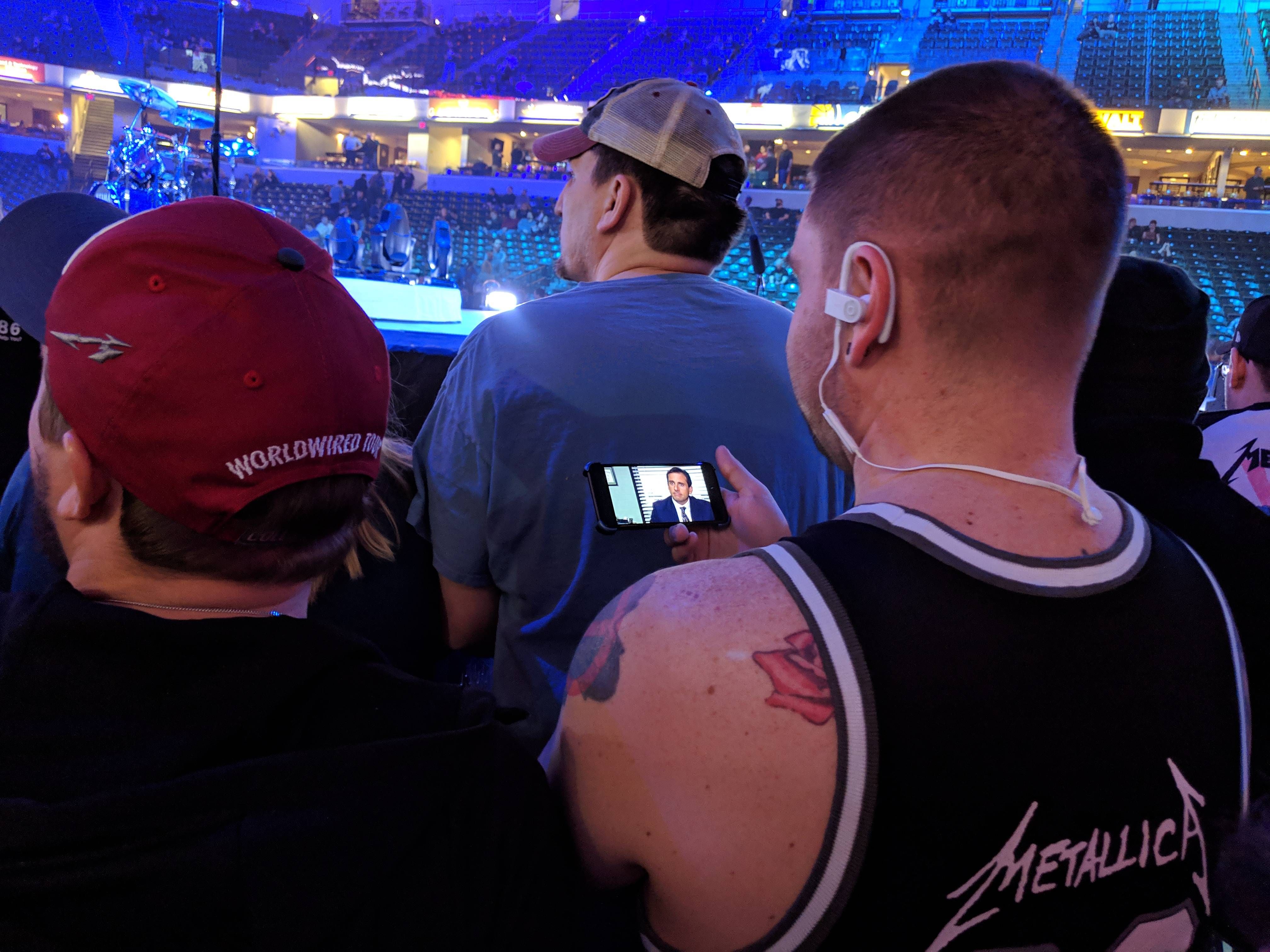 At a Metallica concert and this dude is watching The Office