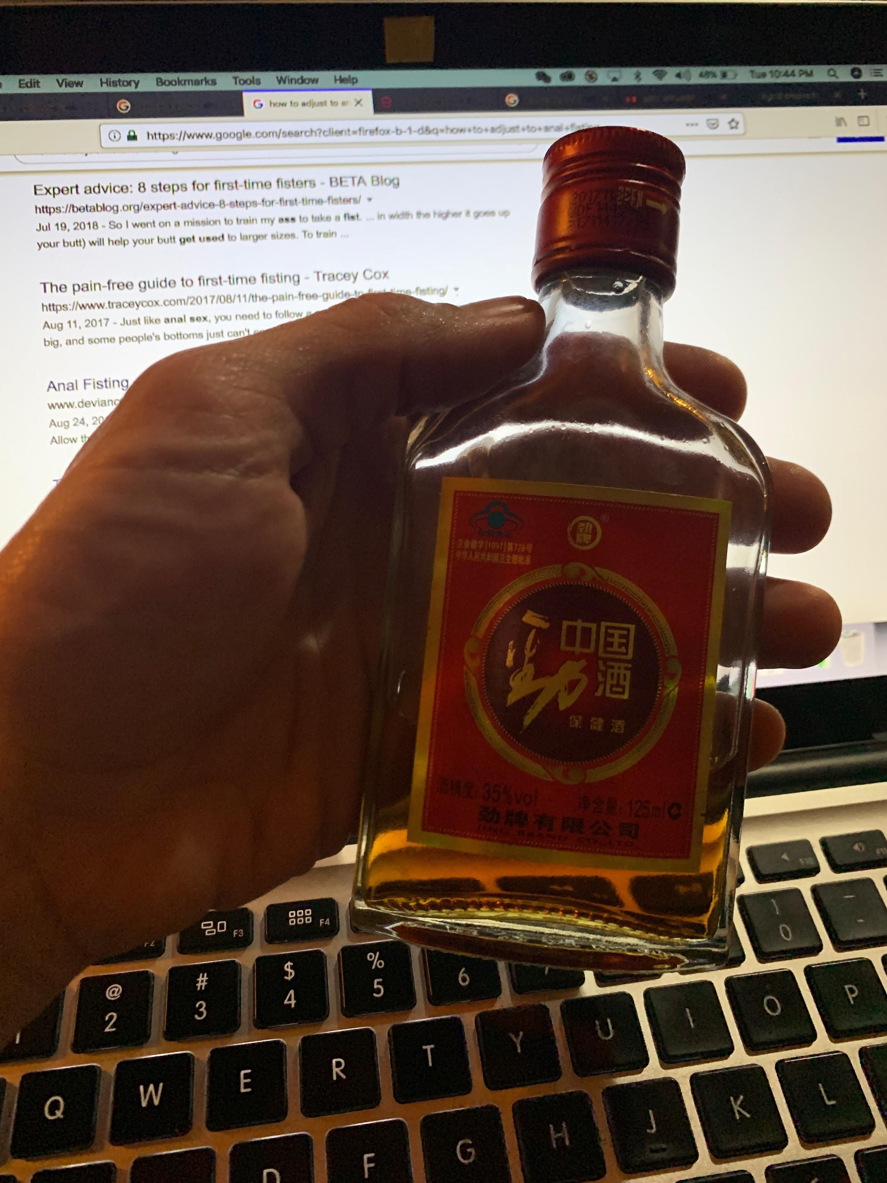 So my buddy was just trying to show us this bottle of liquor his boss bought him...