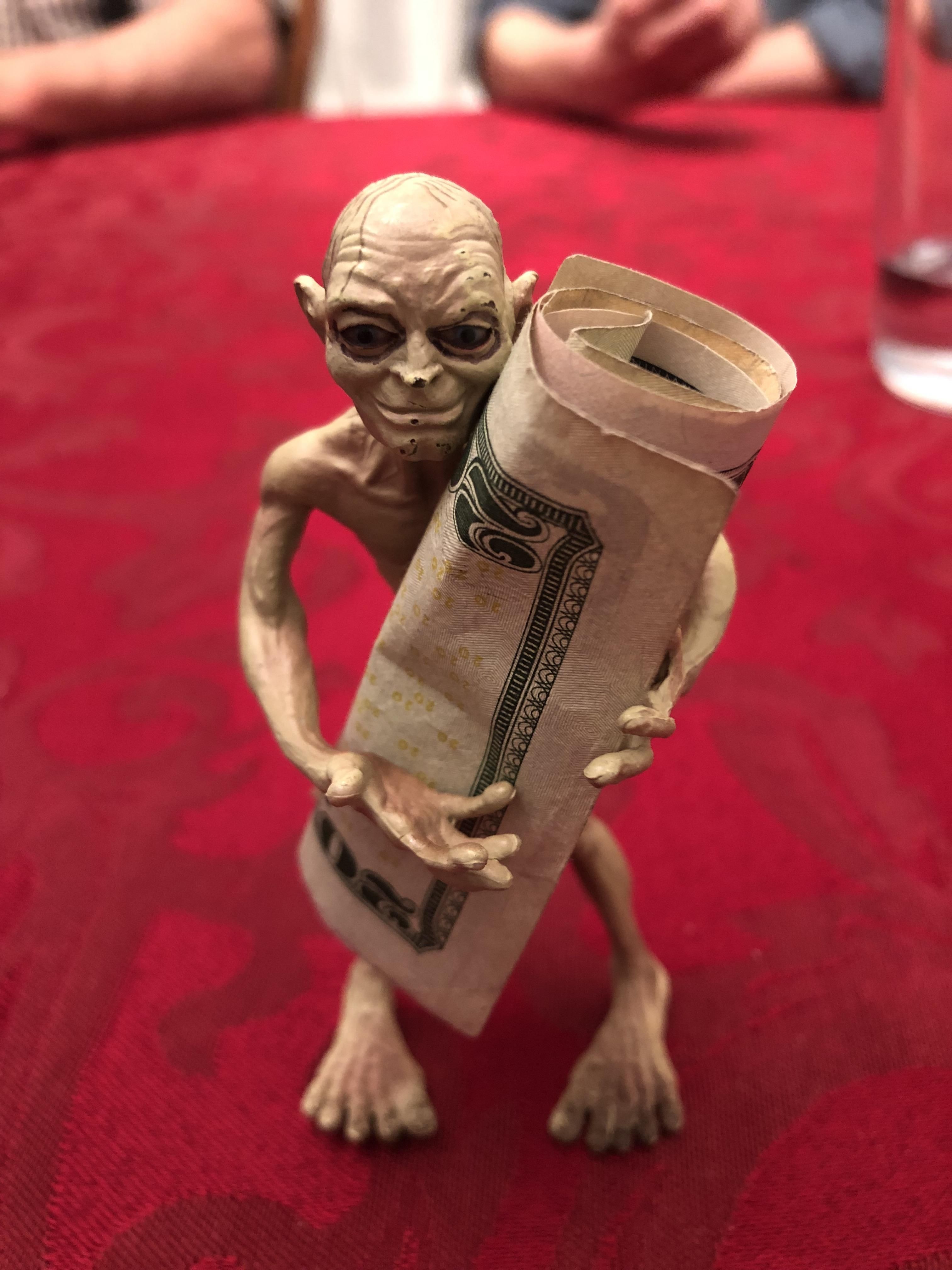 My family and I use this Gollum toy to hold the money when we play cards.