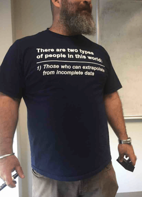 Students were asking the professor why his t-shirt was missing a second line