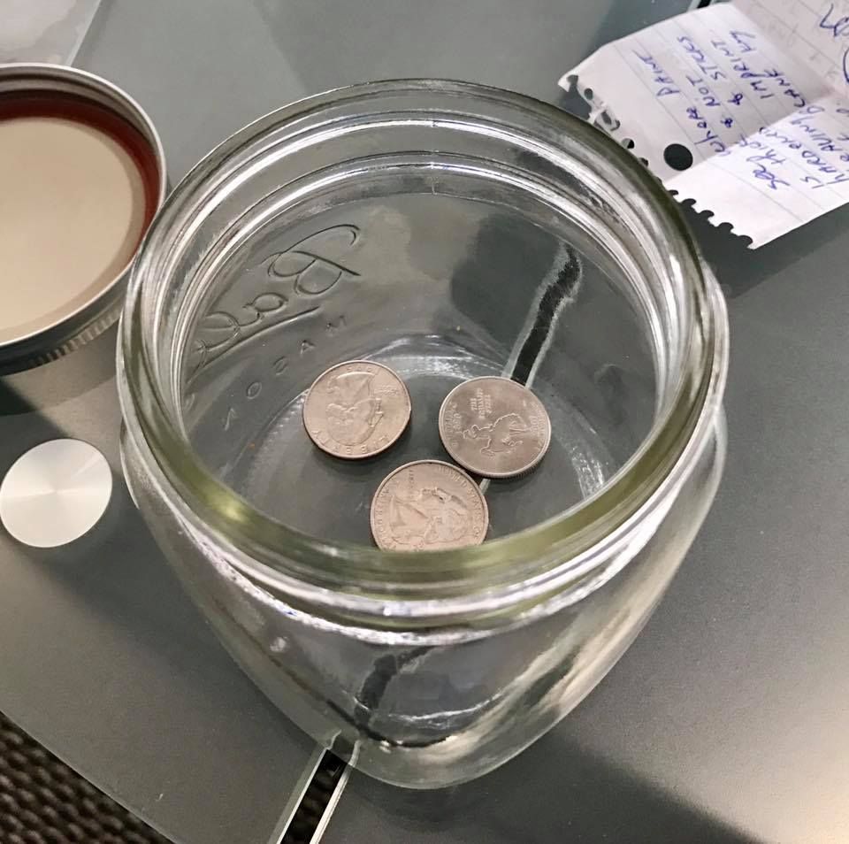 This change jar is three quarters full.