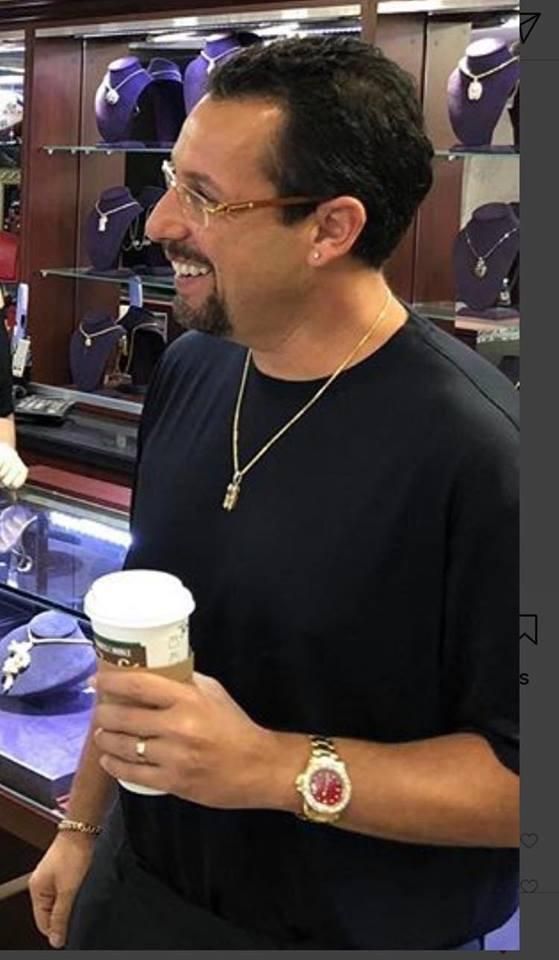 Adam Sandler looks like he owns every gas station in Detroit.