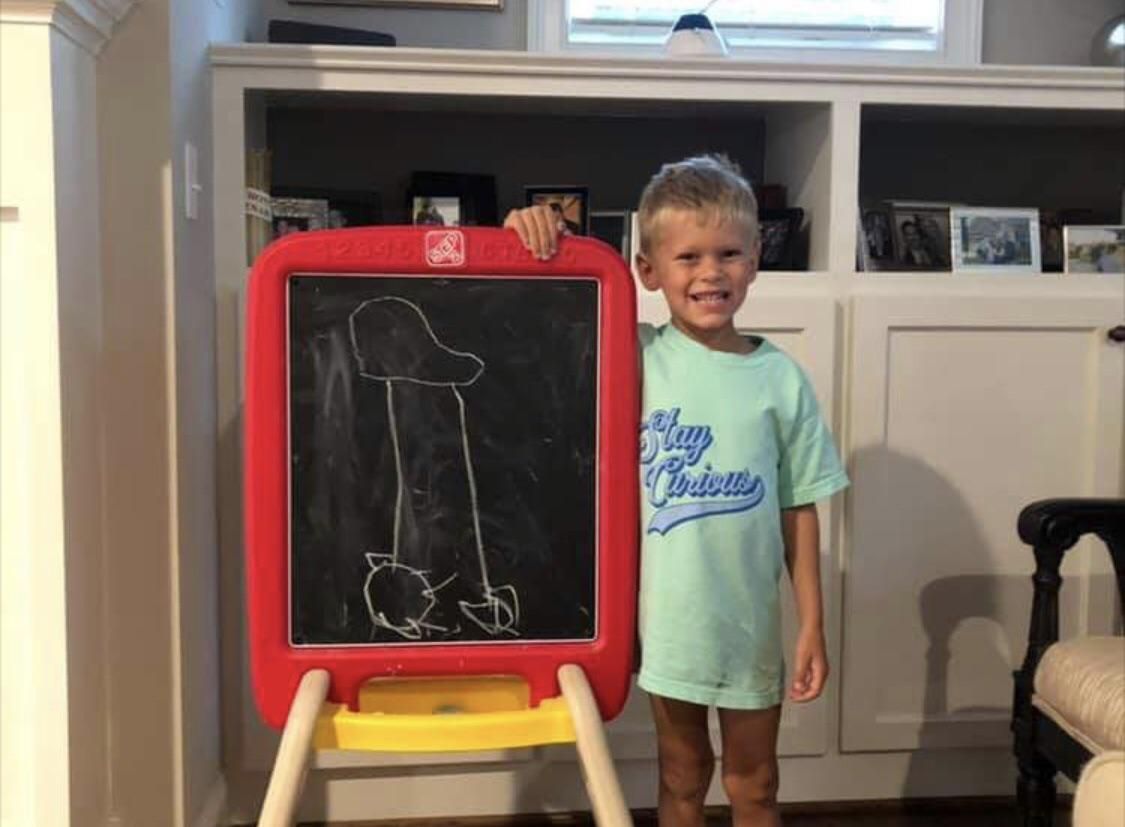 Proud of his monster truck drawing