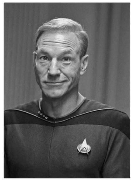 I knew they tried to make Patrick Stewart wear a wig but i'd never seen the photo. The look on the captains face makes my day!