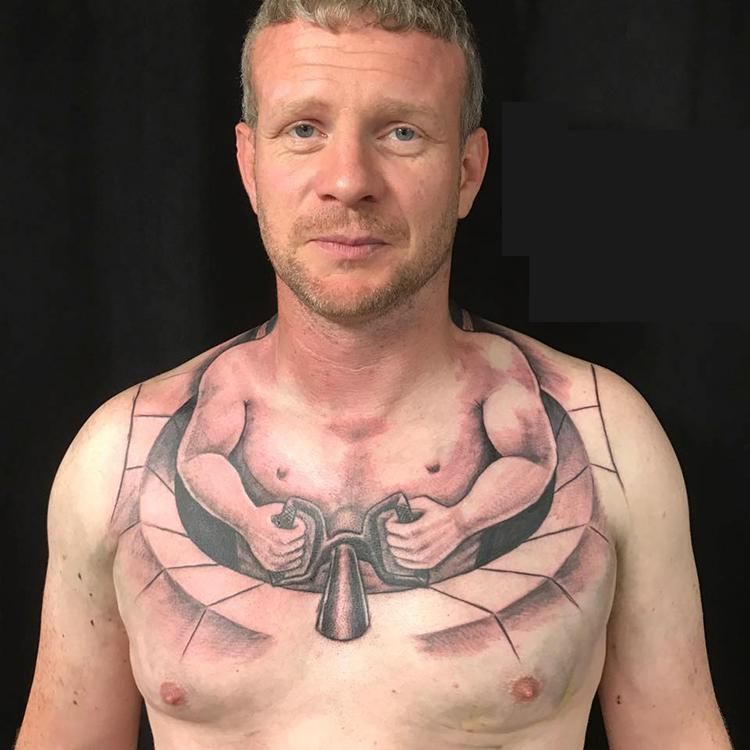 This man's chest tattoo