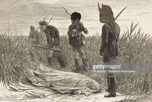 Boys are buried in the Balkan sand on the other side of Danube