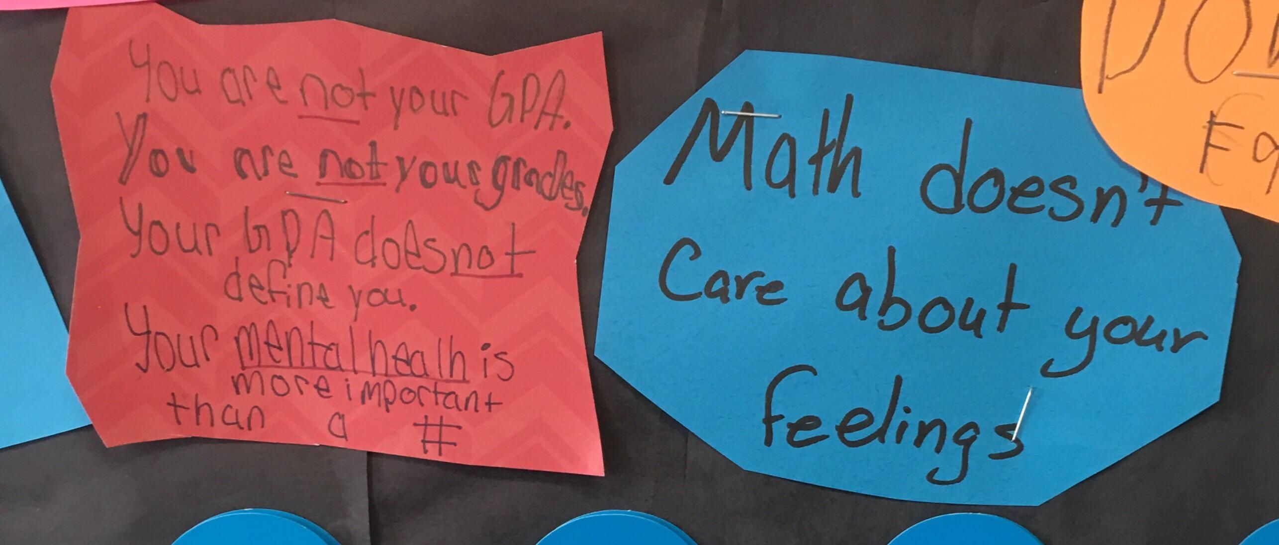 Two students with different messages on a math teacher’s “class tips” board