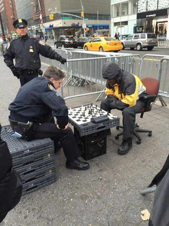 NYPD Officer beating Unarmed Black Man while another Officer stands idly by.