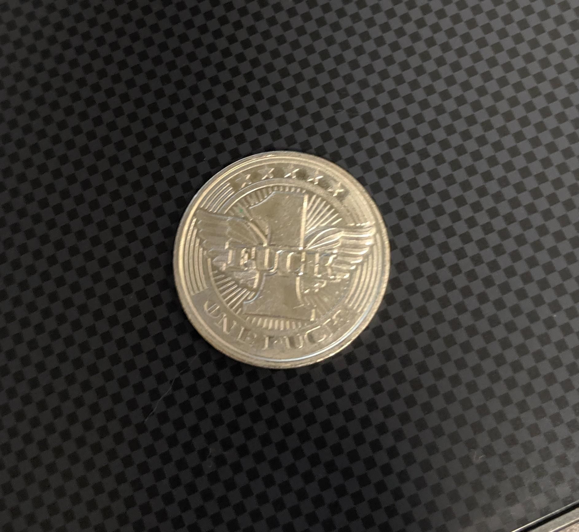 I accidentally gave this to a cashier and couldn't figure out why she was staring at my "quarter" for so long.