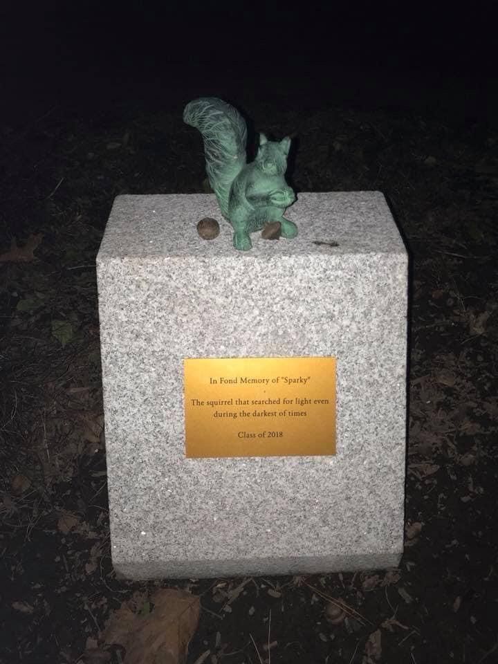 A memorial for the squirrel that ate through a wire that canceled classes for two days. It was paid for by the undergrad class.