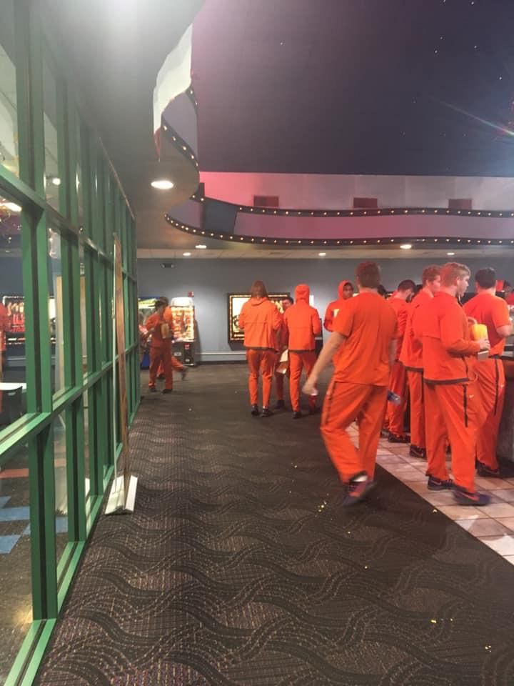 The Clemson Tigers going to see a movie looks like a chain gang got a night out for good behavior.
