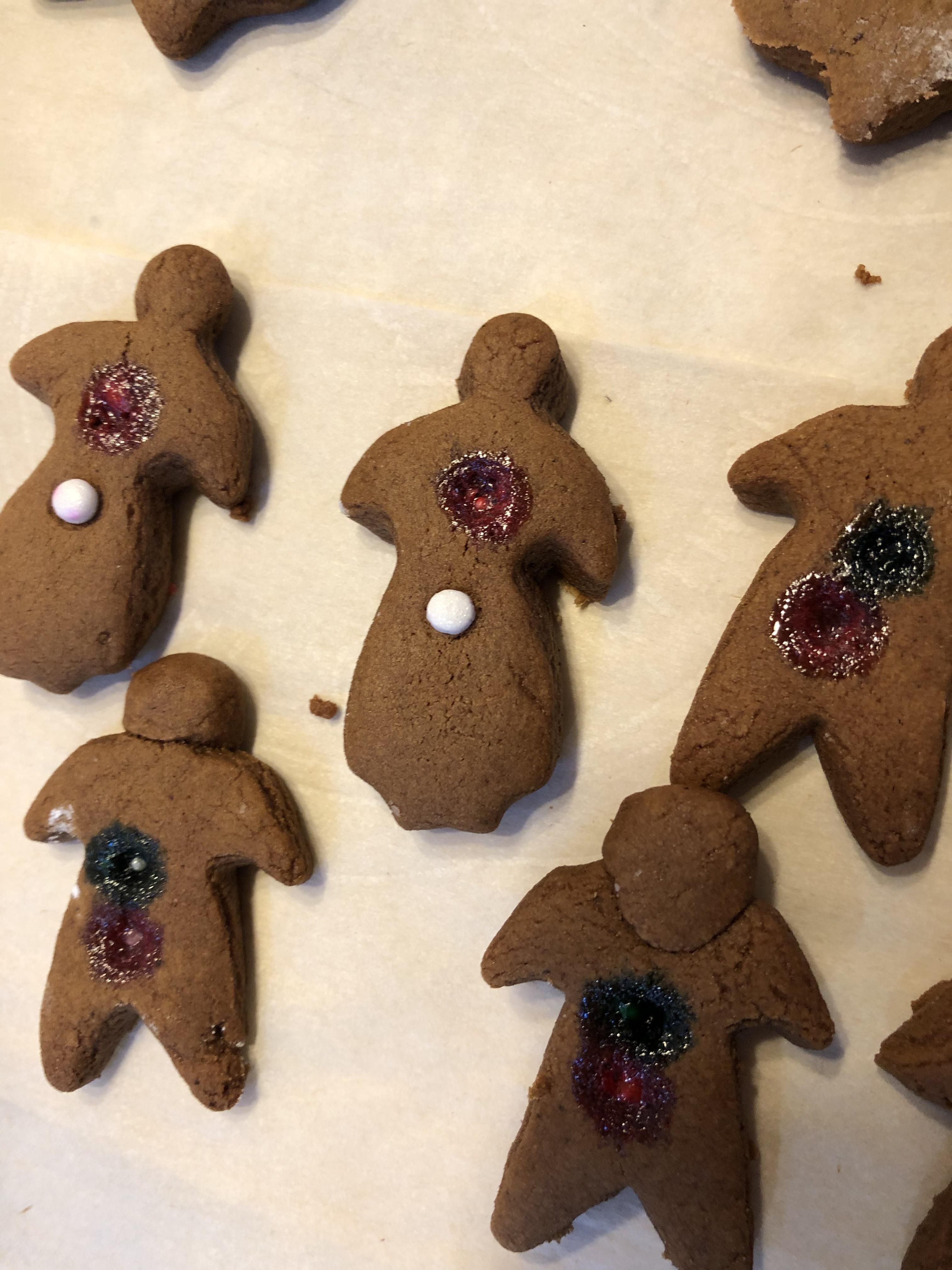My girlfriend made gingerbread people and put the sprinkles on too soon and they melted. Now it looks like they got shot.