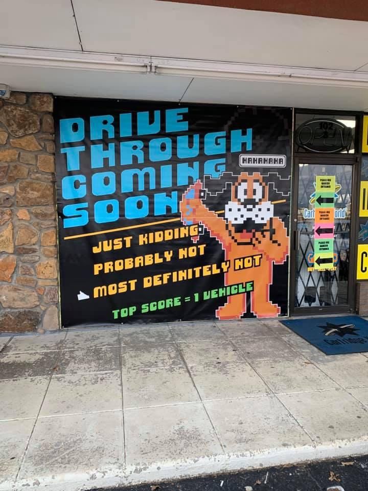 Local gameshop had a driver run through the front window a couple weeks ago. Their new window decal.