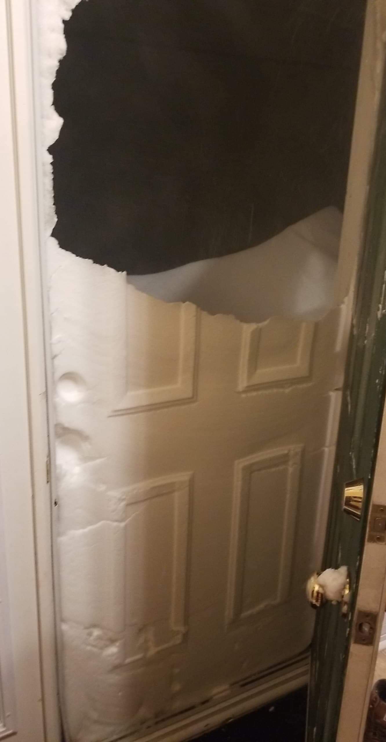Someone broke my brother in laws door... just kidding that's snow in Saint John's Newfoundland