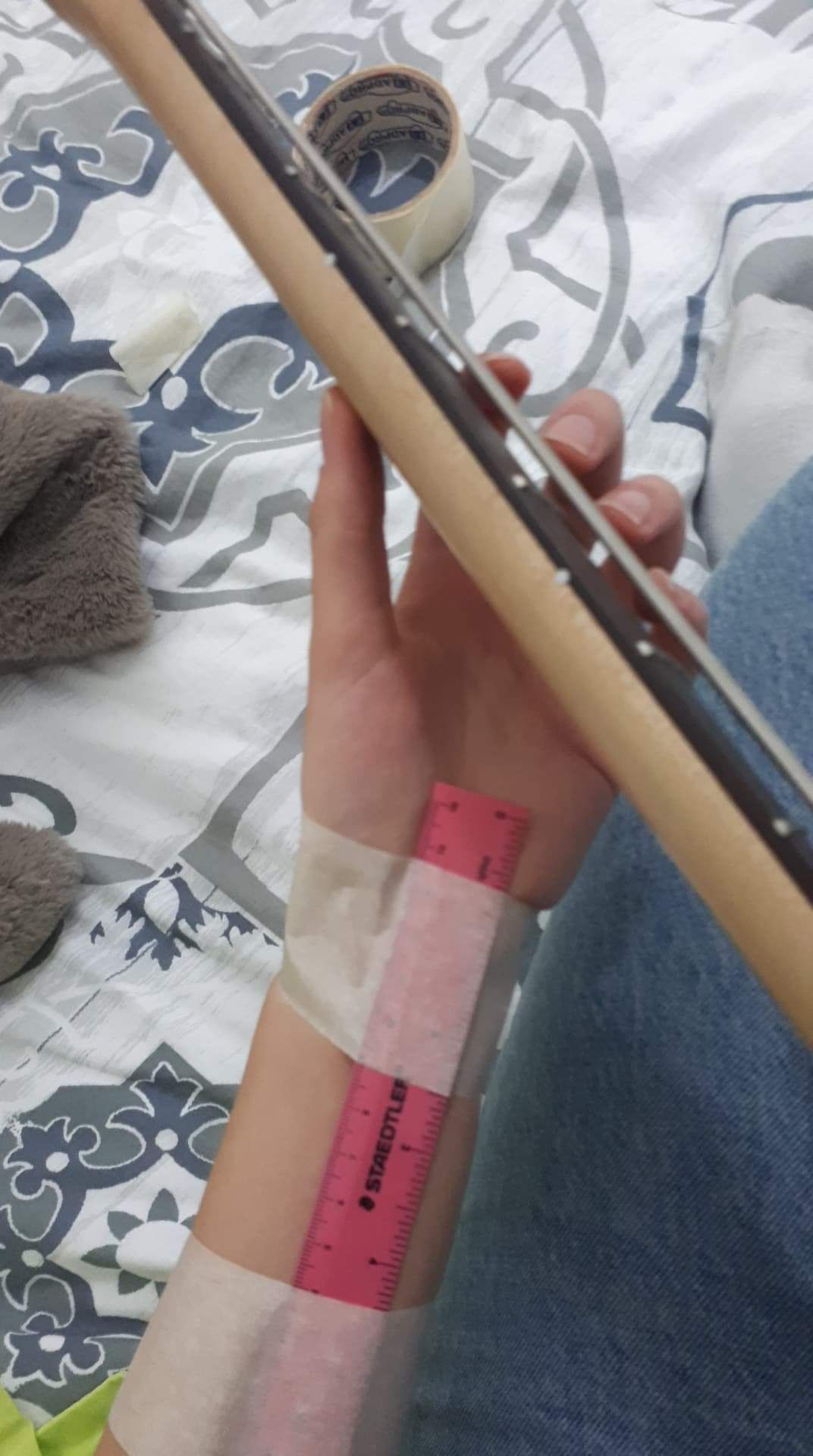 I told my student to keep her wrist straight while playing Bass/Guitar ... and thats what she came up with. I can't say i'm not impressed